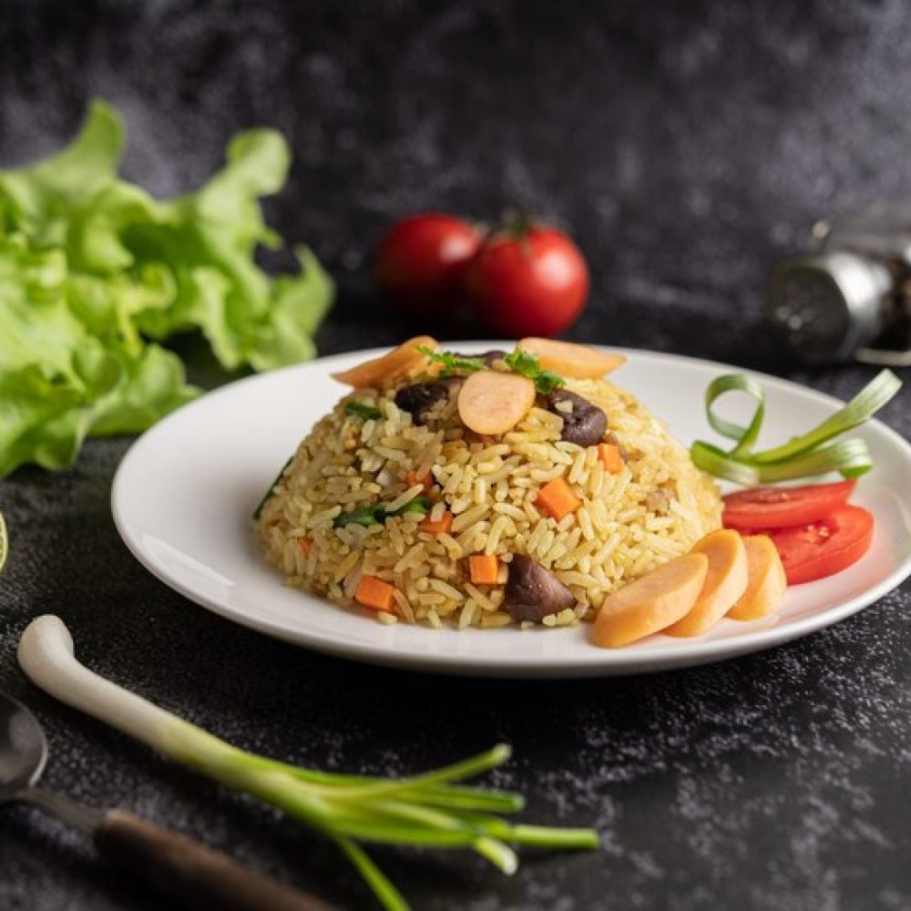 sausage-fried-rice-with-tomatoes-carrots-shiitake-mushrooms-plate_1150-27184